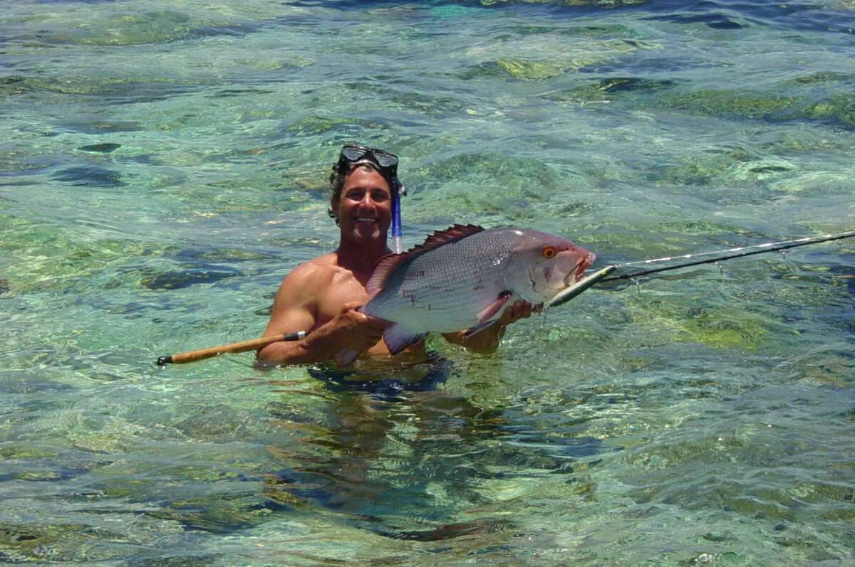 Jose holding a fish